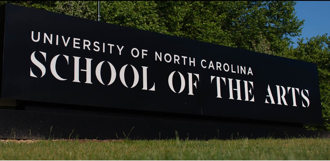 black rectangular sign saying University of North Carolina School of the Arts