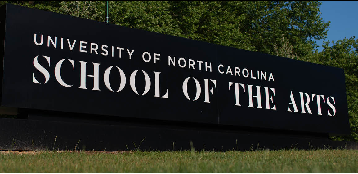 large sign installation saying University of North Carolina School of the Arts